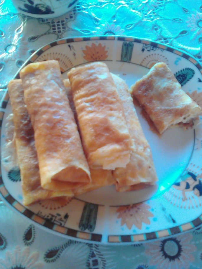 Taste-testing wedding food before the wedding!  These were like crepes stuffed with brinza, which is a sweet sheep cheese (that I don't like very much!).